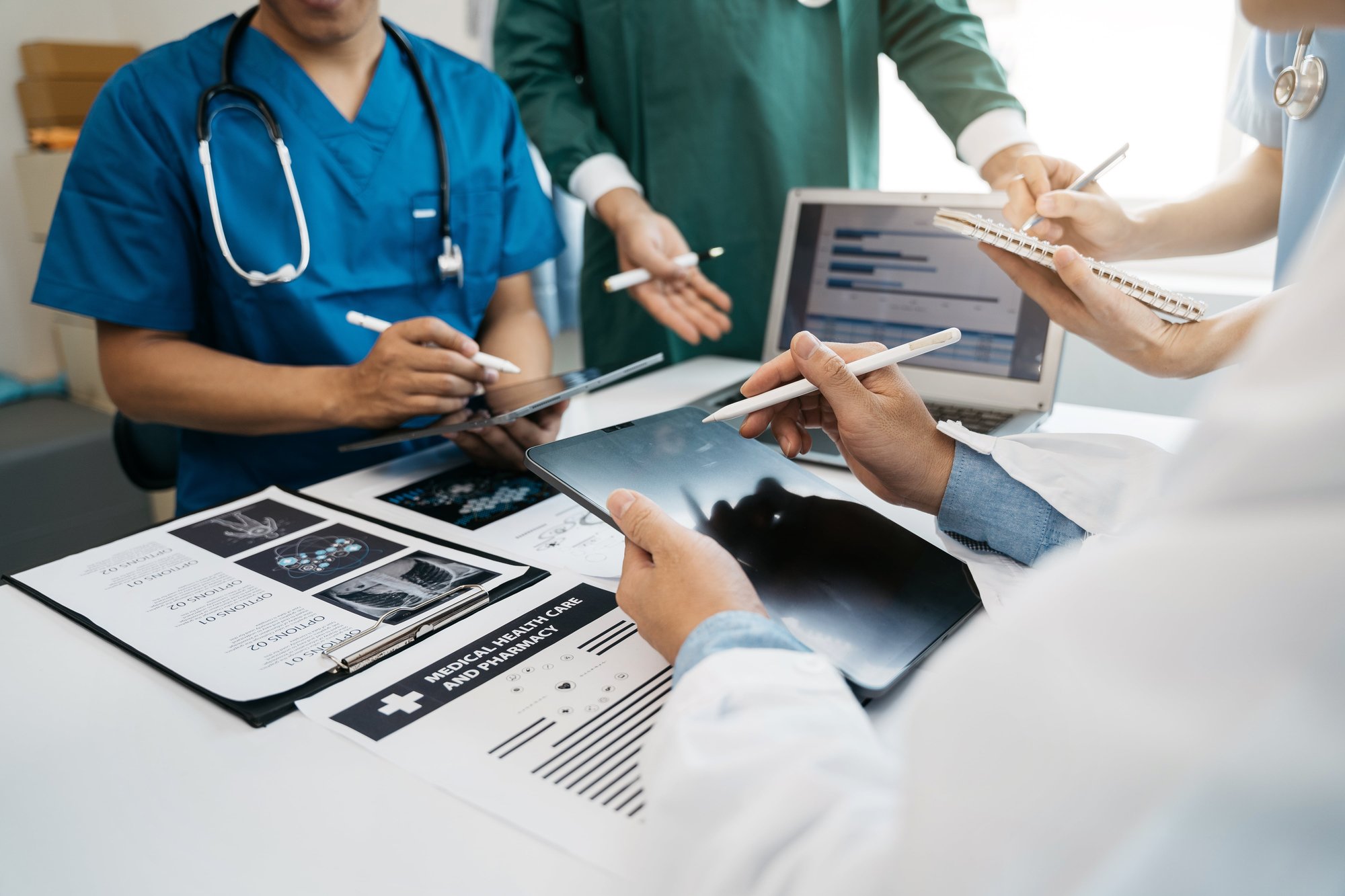 Medical team working on digital tablet healthcare doctor technology_605930376-min